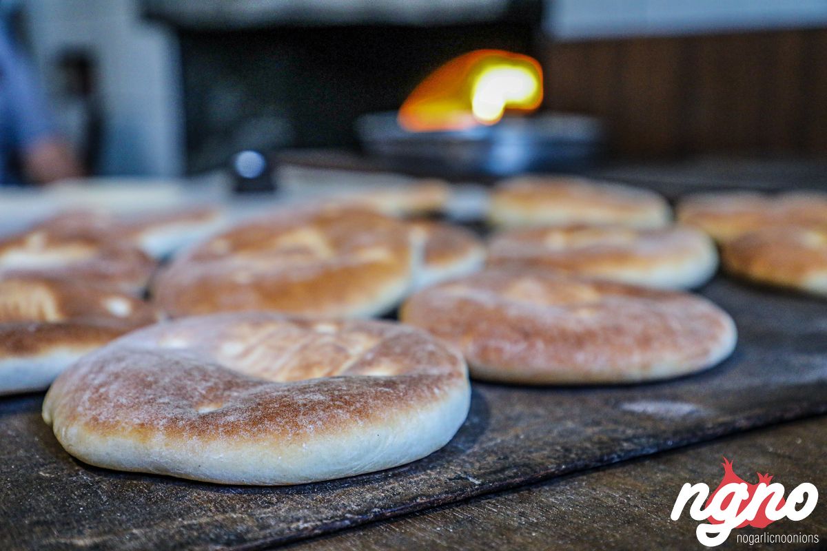 Baking Pita bread in a traditional bakery in Lebanon.